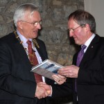 John Hooton presenting IPF president John Cuddihy with a copy of his book